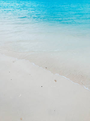 Serene Blue Ocean And The Shore Wallpaper