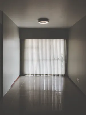 Serene Simplicity: An Empty Room With Closed Curtains Wallpaper