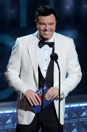 Seth Macfarlane Looking Suave Against A Sharp Backdrop Wallpaper