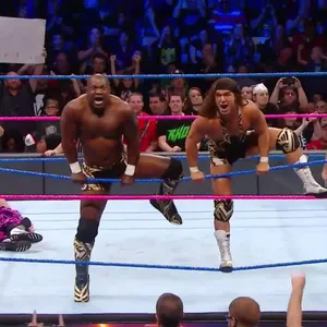 Shelton Benjamin And Chad Gable In The Heat Of A Fatal 4-way Match Wallpaper