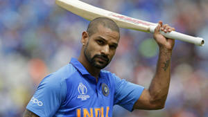 Shikhar Dhawan Raising Bat Wallpaper