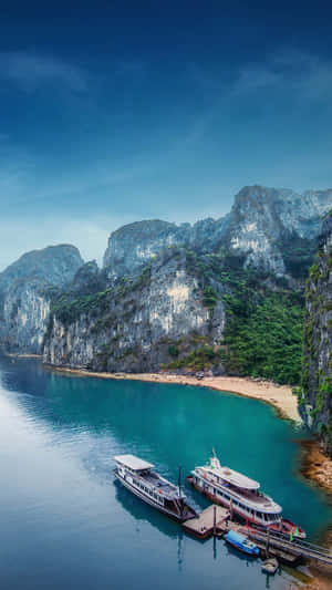 Ships Docked Near Halong Bay's Shore Wallpaper