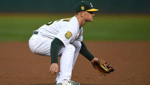 Side View Of Matt Chapman Crouching Wallpaper