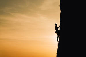 Silhouette Mountain Climber Wallpaper