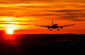 Silhouette Of Finnair Aircraft At Sunset Wallpaper