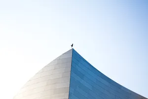 Silhouette Of Man On Sharp Edged Wall Wallpaper