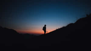 Silhouetteof Hikerat Dusk.jpg Wallpaper