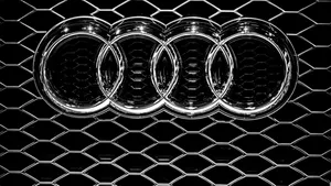 Silver Audi Car Emblem In Solid Black Wallpaper