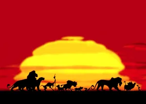Simba Standing Proudly Against A Glorious Sunset Wallpaper