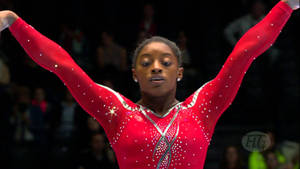 Simone Biles Closeup Performance Wallpaper