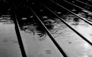 Simple Black Rain On Wooden Panels Wallpaper