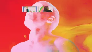 Singer-songwriter Frank Ocean Leaning Back In A Chair, Typing On His Laptop Wallpaper