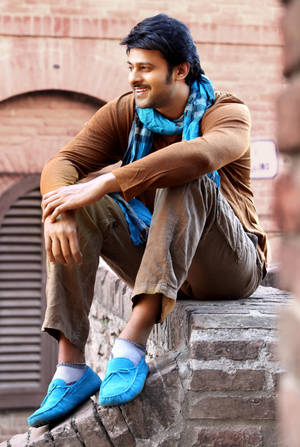 Sitting On Wall Prabhas Mirchi Wallpaper