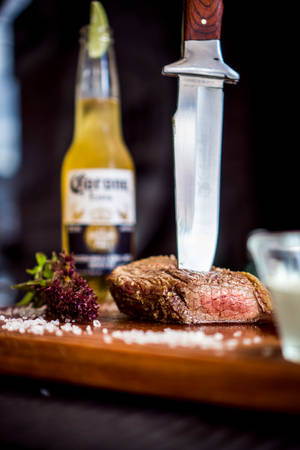 Sizzling Steak On Traditional Argentinian Parrilla Wallpaper