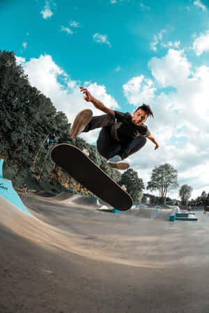 Skateboarder Mid Air Trick Skatepark.jpg Wallpaper