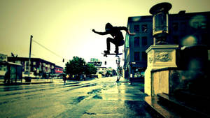 Skateboarder Takes A Break During A Street Session Wallpaper