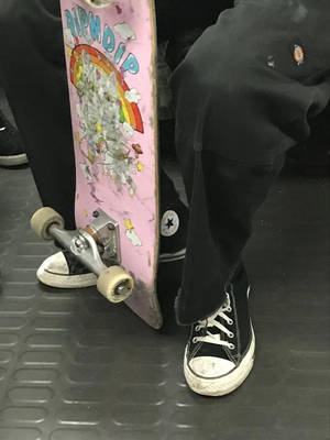 Skater Catching A Ride Wallpaper