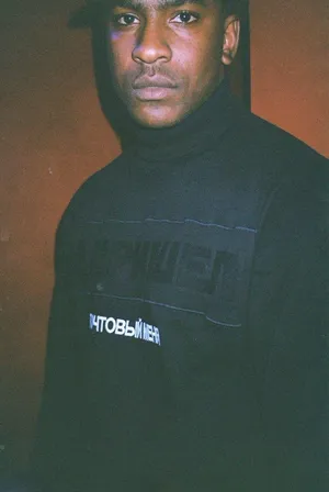 Skepta On A Dark Room Wallpaper