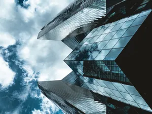 Skyscraper Under The Clouds Wallpaper