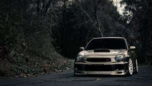 Sleek And Shiny Dark Jdm Car Glowing Under The Night Sky Wallpaper