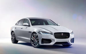 Sleek And Sporty White Jaguar Car Wallpaper