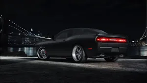 Sleek Dodge Challenger In Pitch Black Wallpaper