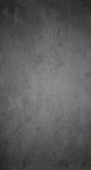 Sleek Grey Iphone On Stained Steel Surface Wallpaper