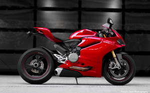 Sleek Red Ducati 1299 Panigale In An Urban Setting Wallpaper