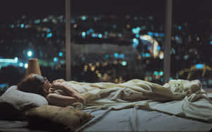 Sleeping On A Room On Top Of A Building Wallpaper