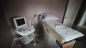 Small Hospital Bed With Medical Instrument Wallpaper