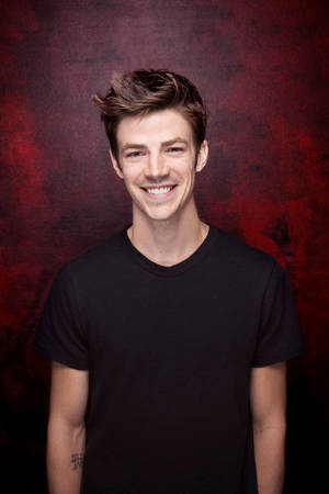 Smiling Grant Gustin Wallpaper