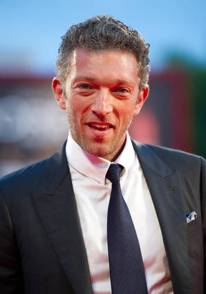 Smiling Vincent Cassel Selective Focus Wallpaper