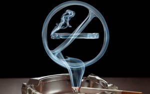 Smoking Cigarette In Tray Wallpaper