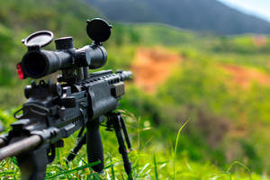 Sniper Gun On A Hill Wallpaper