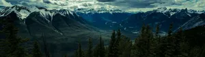 Snow Capped Mountains On A Winter Day Wallpaper