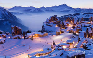 : Snow-capped Ski Mountain At Sunrise Wallpaper