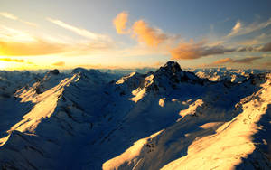 Snowy Mountain Ranges Sunset Desktop Wallpaper