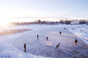 Snowy Outdoor Ice Hockey Wallpaper