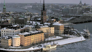 Snowy Stockholm Skyline In Winter Wallpaper