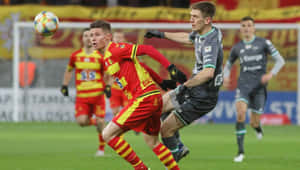 Soccer Action Duel During Match Wallpaper