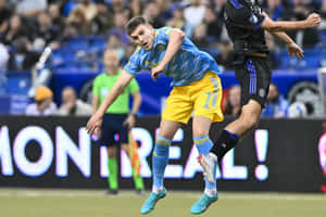 Soccer Action Mikael Uhre Wallpaper