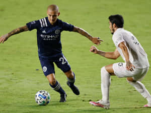 Soccer Dribble Action Shot Wallpaper