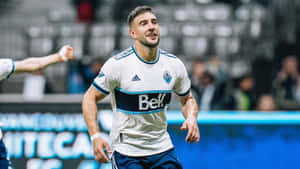 Soccer Player Celebration Moment Wallpaper