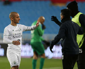 Soccer Player Celebrationwith Team Mate Wallpaper