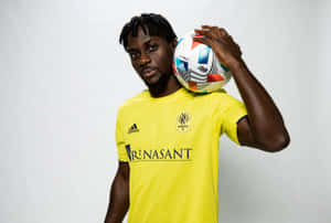 Soccer_ Player_ Holding_ Ball Wallpaper