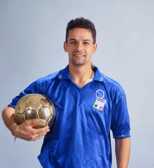 Soccer Player Holding Golden Ball Wallpaper