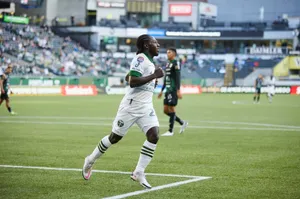 Soccer_ Player_in_ Action_on_ Field.jpg Wallpaper