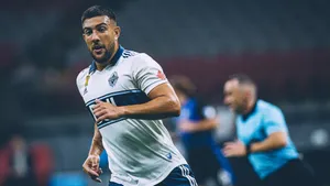 Soccer_ Player_ In_ Action_ On_ Field Wallpaper