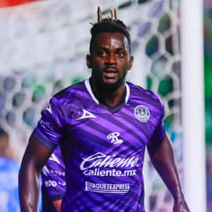 Soccer_ Player_in_ Purple_ Kit Wallpaper
