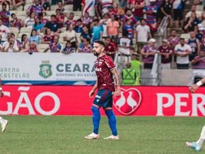 Soccer_ Player_on_ Field_ During_ Match.jpg Wallpaper